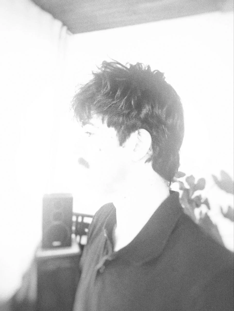 Portrait of Aster Allard, in profile, overexposed black and white